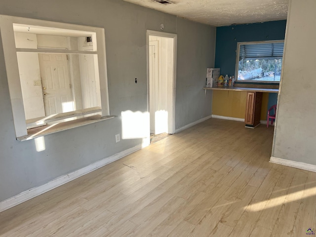 unfurnished living room with light hardwood / wood-style floors