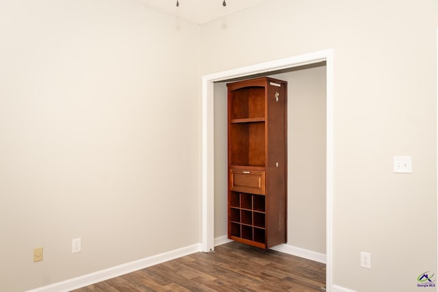 empty room featuring dark hardwood / wood-style floors