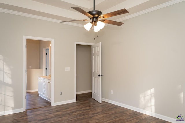 unfurnished bedroom featuring dark wood-type flooring, ceiling fan, crown molding, and connected bathroom