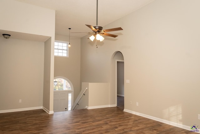 interior space with high vaulted ceiling, ceiling fan, and dark hardwood / wood-style flooring