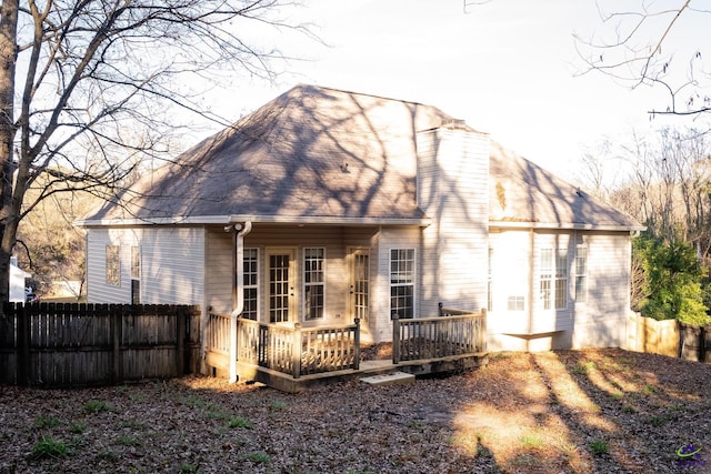 back of property with a deck