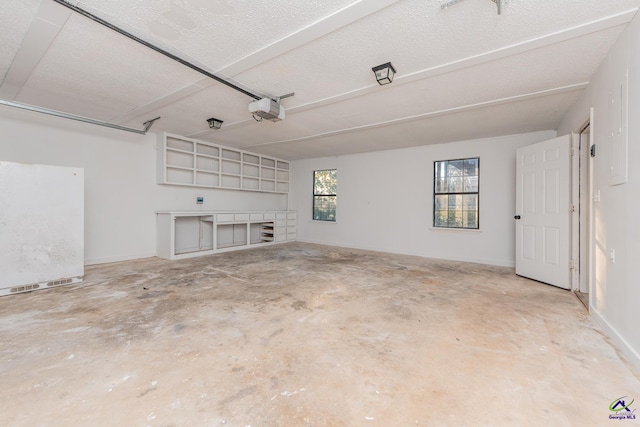 garage with white refrigerator and a garage door opener