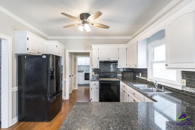 kitchen featuring black appliances, white cabinets, and sink