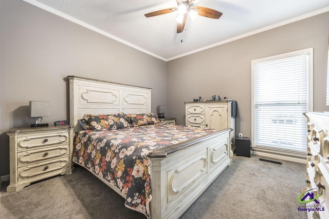 carpeted bedroom with ceiling fan, ornamental molding, and a textured ceiling