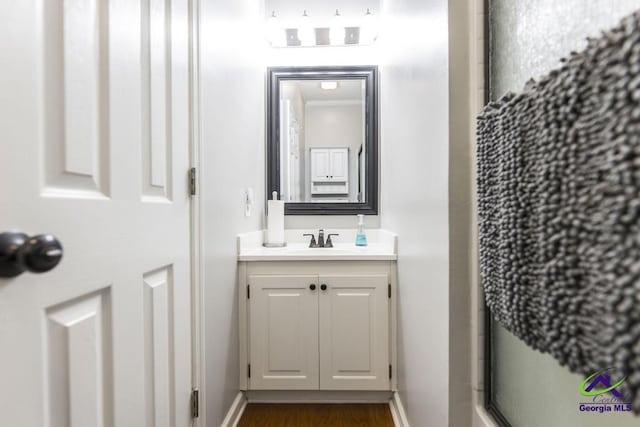 bathroom featuring an enclosed shower and vanity