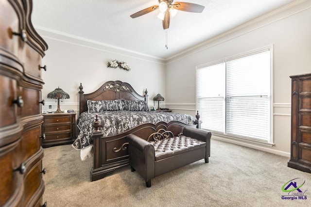 carpeted bedroom featuring ceiling fan, crown molding, and multiple windows