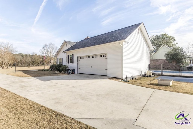 view of property exterior with a garage