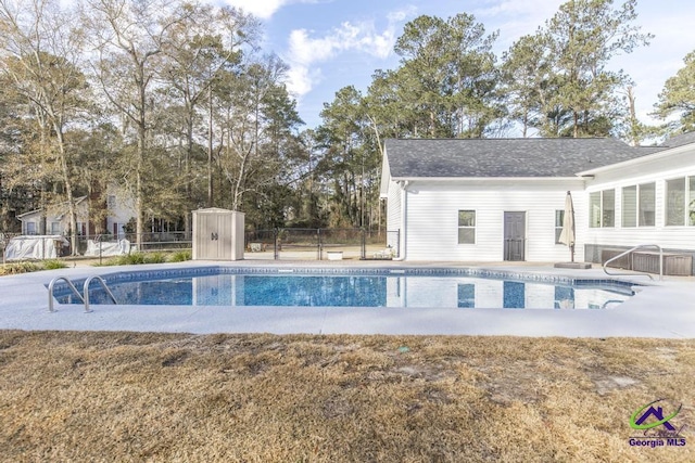 view of pool with a shed