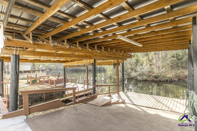 unfurnished sunroom with a water view