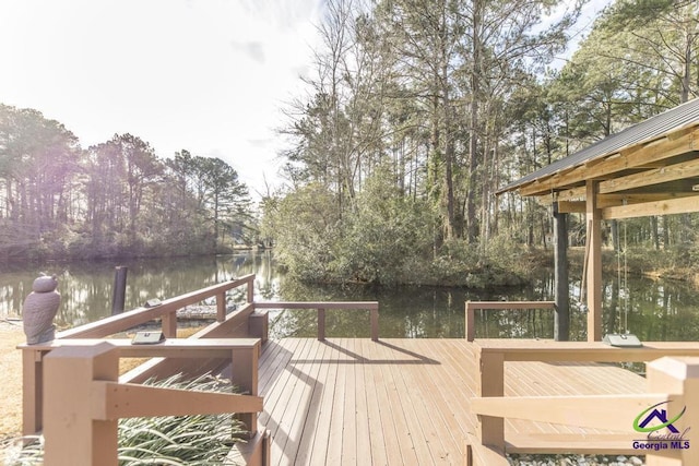 wooden deck featuring a water view