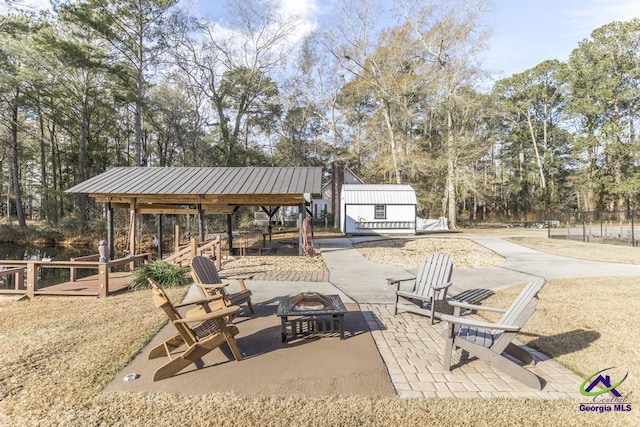 view of patio / terrace featuring an outdoor fire pit