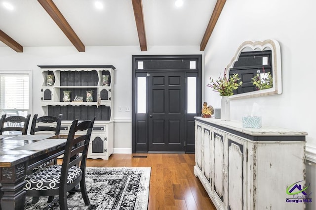 foyer entrance featuring beamed ceiling and hardwood / wood-style floors