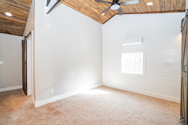 carpeted spare room featuring wood ceiling, a wall mounted AC, a barn door, ceiling fan, and lofted ceiling