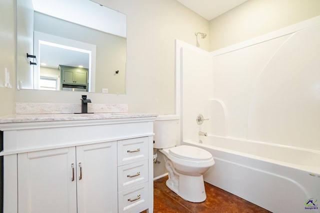 full bathroom with washtub / shower combination, vanity, and toilet