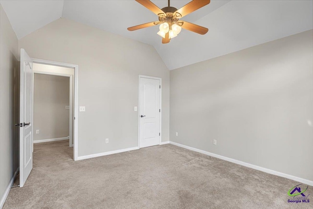 unfurnished bedroom featuring lofted ceiling, ceiling fan, and light carpet