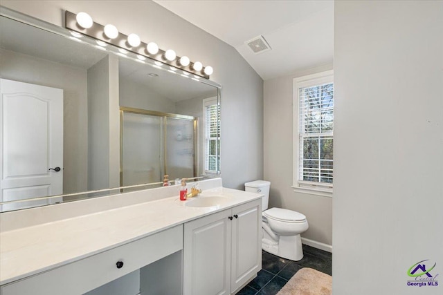 bathroom featuring toilet, a shower with door, tile patterned floors, vaulted ceiling, and vanity