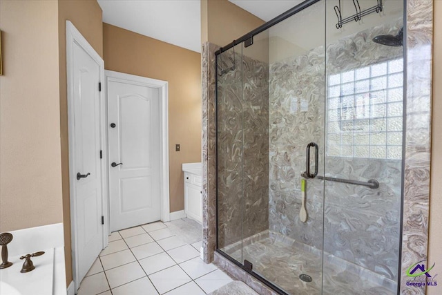 bathroom featuring a shower with shower door, tile patterned floors, and vanity