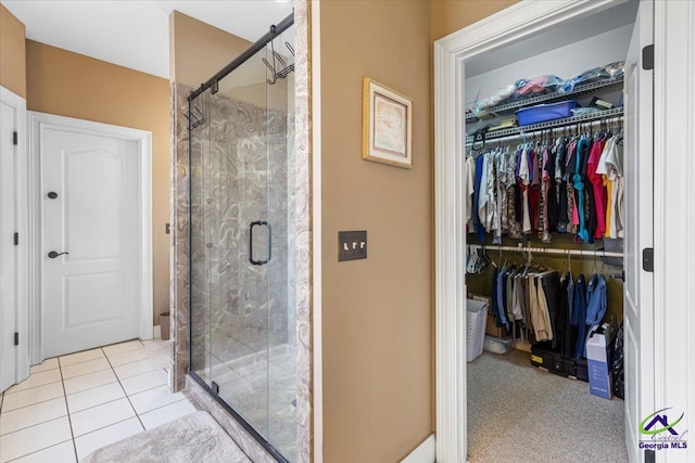 bathroom featuring tile patterned floors and walk in shower