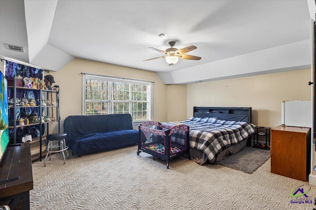 bedroom featuring ceiling fan, light carpet, and lofted ceiling