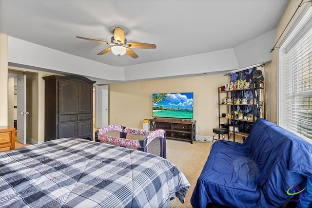 carpeted bedroom with ceiling fan