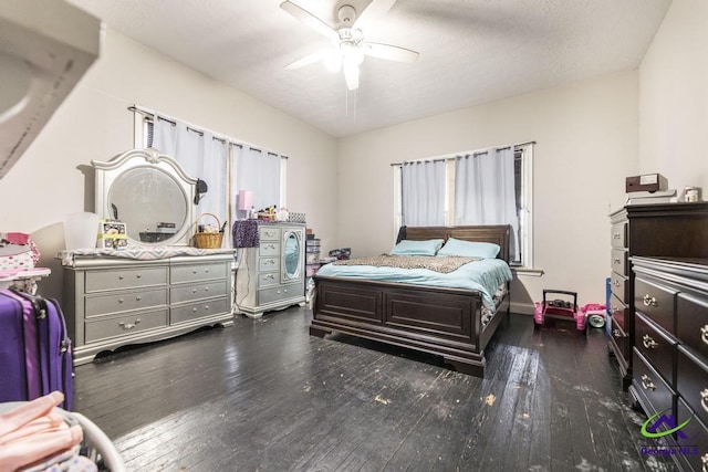 bedroom featuring ceiling fan and dark hardwood / wood-style floors