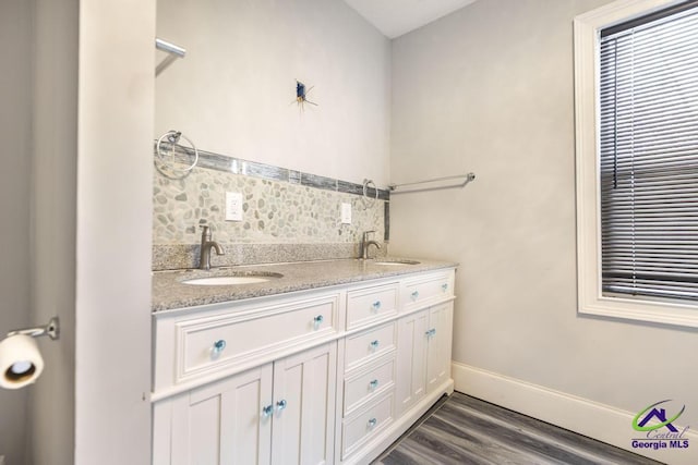 bathroom with wood-type flooring and vanity