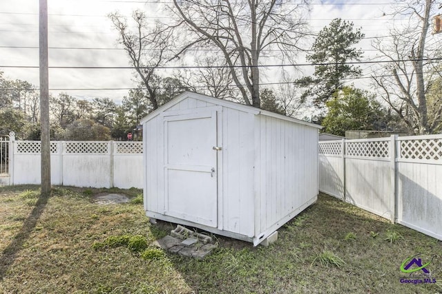 view of outdoor structure with a lawn