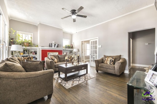 living room featuring ceiling fan, dark wood-type flooring, french doors, a textured ceiling, and ornamental molding