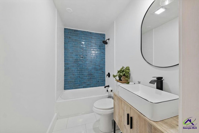 full bathroom with tile patterned floors, toilet, vanity, and tiled shower / bath