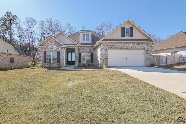 craftsman house featuring a front lawn and a garage