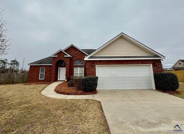 ranch-style home with a front lawn and a garage