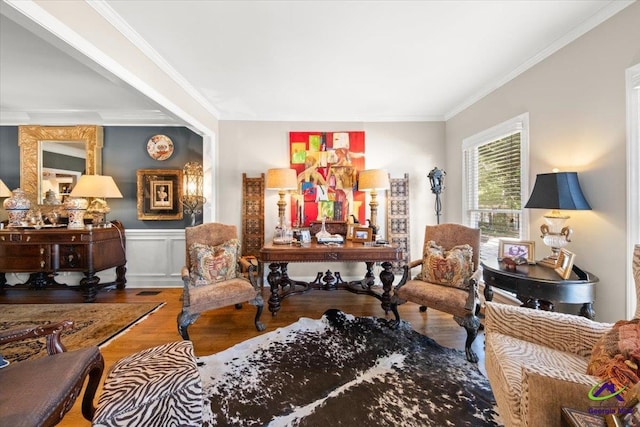 living area with ornamental molding and hardwood / wood-style flooring