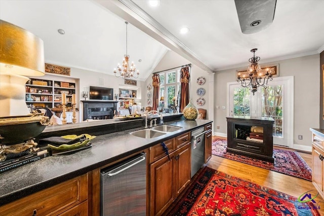 kitchen featuring ornamental molding, stainless steel dishwasher, hardwood / wood-style flooring, and sink