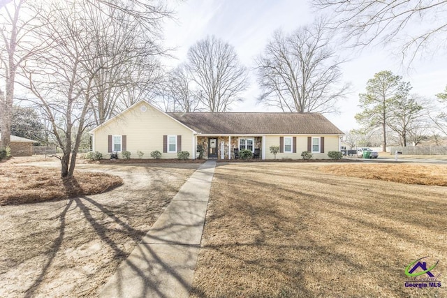 ranch-style home with a front yard