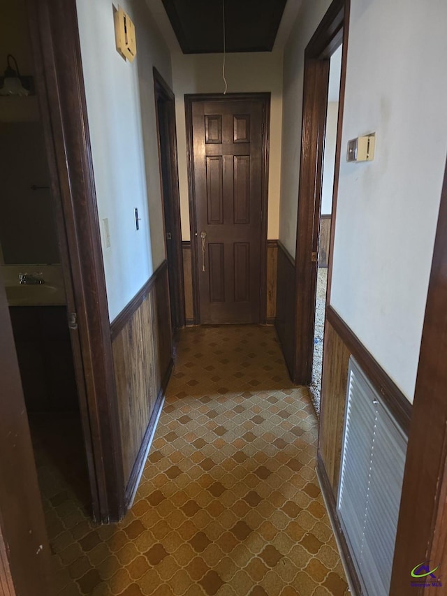 hallway with wooden walls