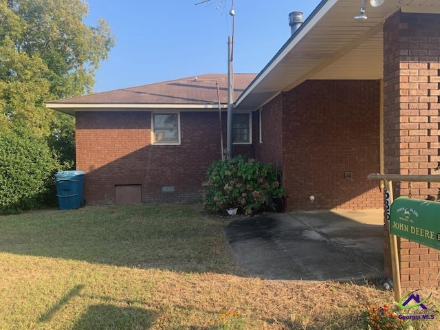 view of property exterior with a lawn