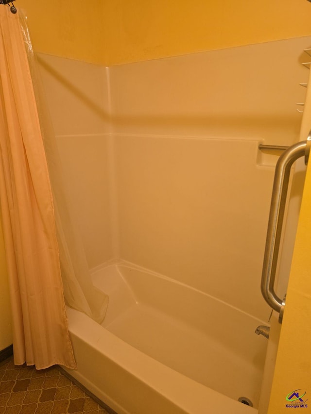 bathroom with tile patterned floors