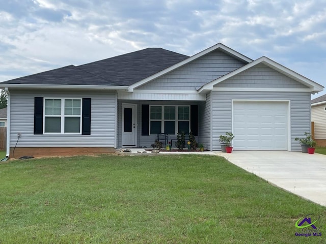 view of front facade featuring a front lawn, a porch, and a garage