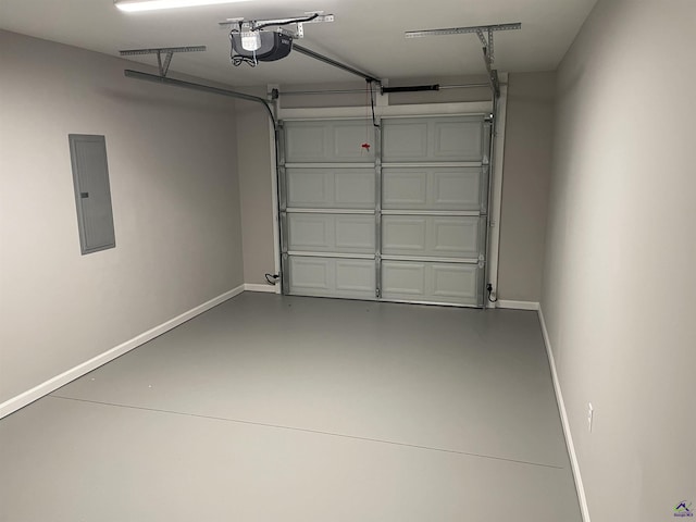 garage with a garage door opener and electric panel