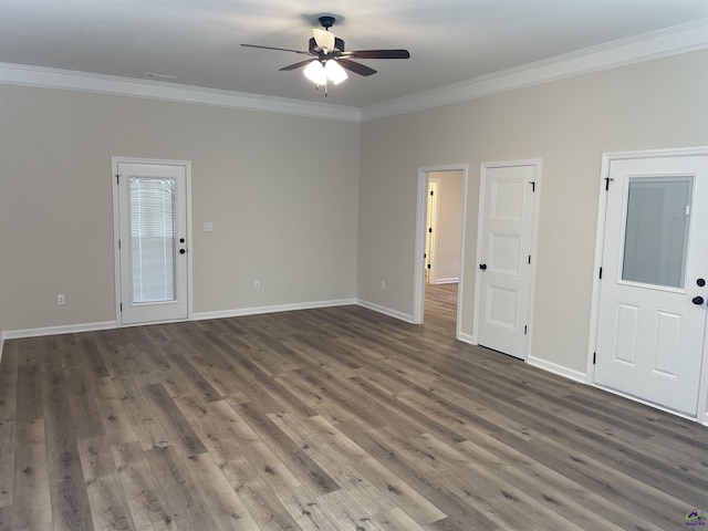 empty room with ceiling fan, dark wood-type flooring, and crown molding