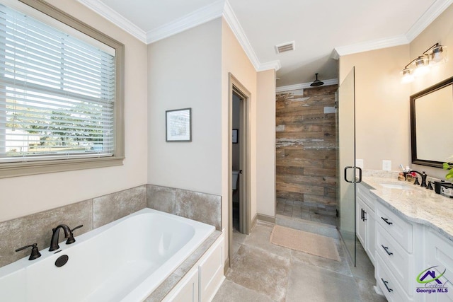 bathroom with crown molding, vanity, and shower with separate bathtub