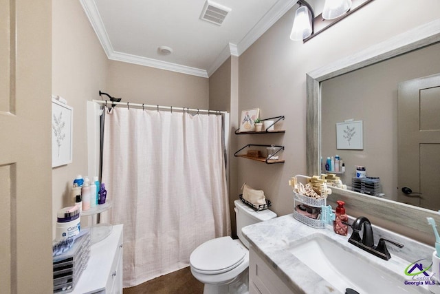 bathroom featuring vanity, crown molding, and toilet