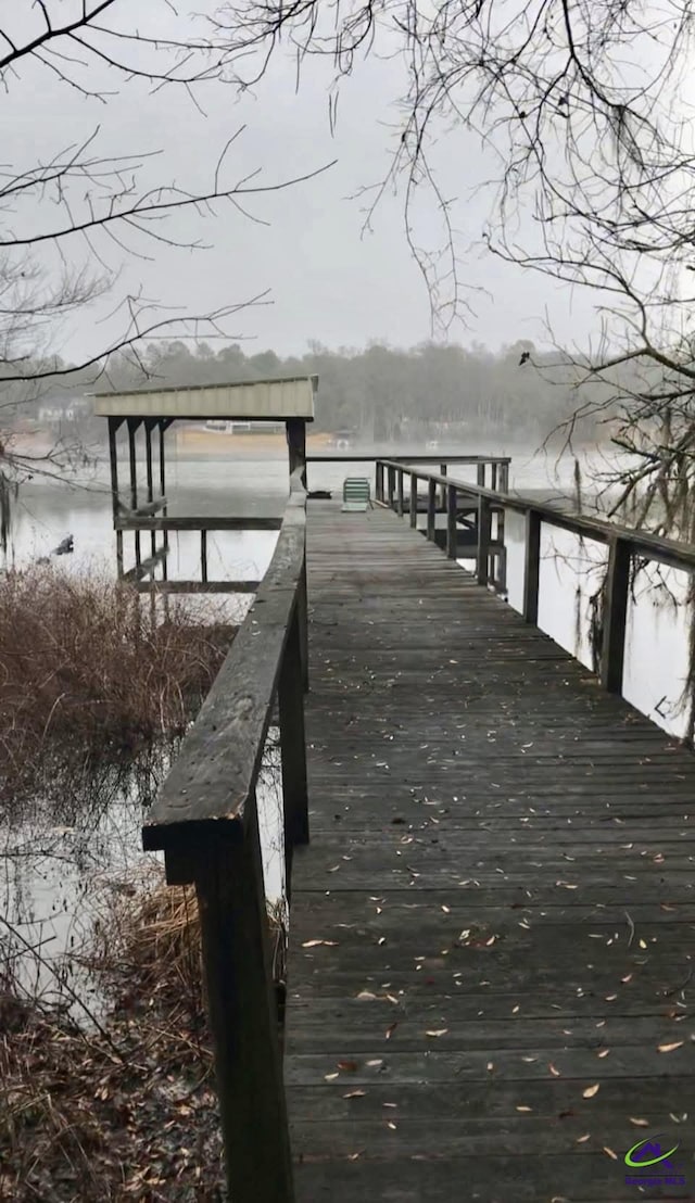 dock area featuring a water view