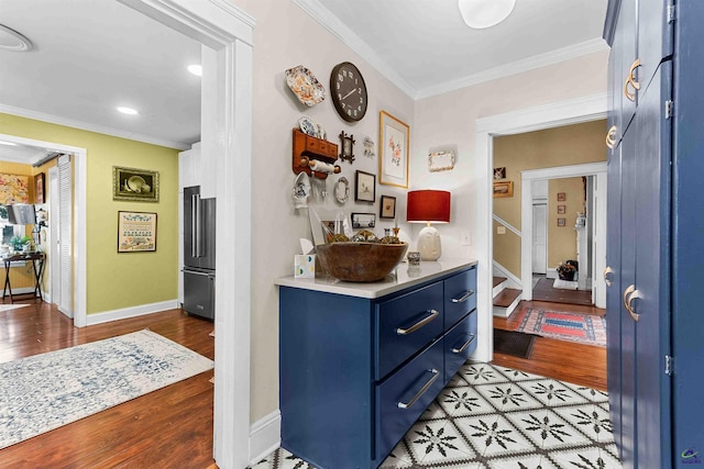 corridor featuring light wood-type flooring and crown molding