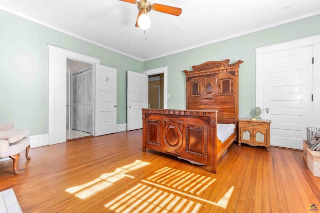 bedroom featuring ceiling fan, crown molding, and hardwood / wood-style flooring