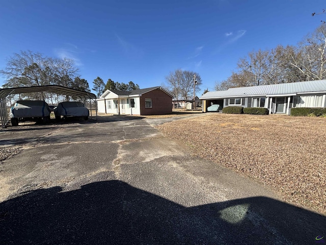 ranch-style home with a carport