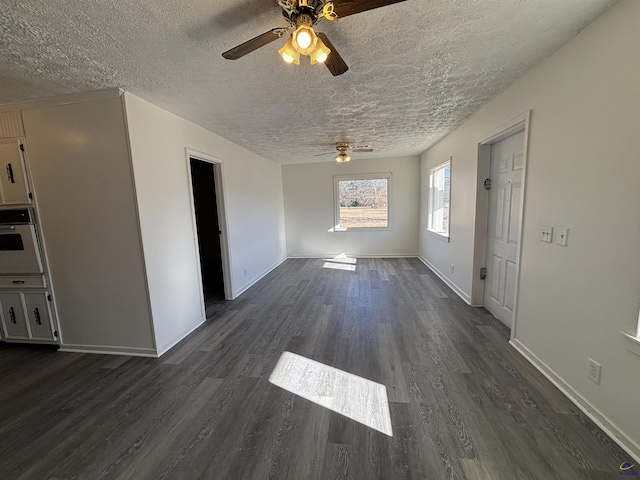 570 Perry Hwy, Hawkinsville, GA 31036 - interior space with ceiling fan, dark hardwood / wood-style flooring, and a textured ceiling