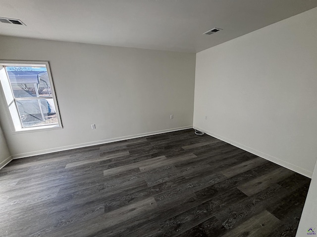 570 Perry Hwy, Hawkinsville, GA 31036 - unfurnished room with dark wood-type flooring
