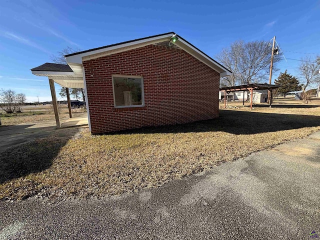 570 Perry Hwy, Hawkinsville, GA 31036 - view of home's exterior with a pergola and a carport
