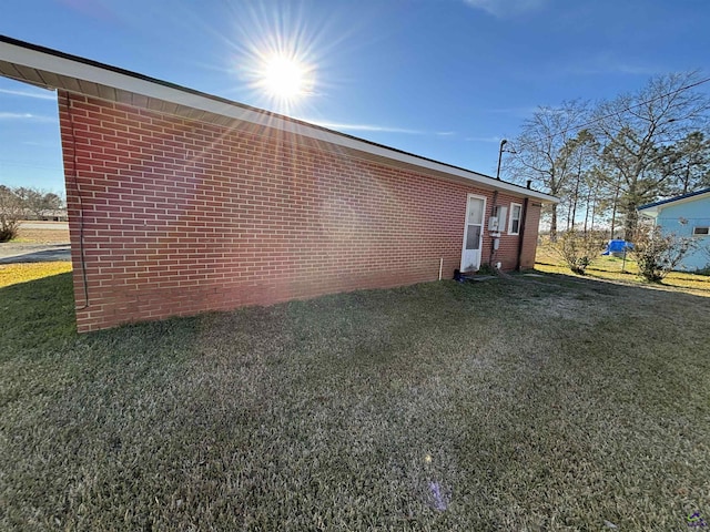 570 Perry Hwy, Hawkinsville, GA 31036 - view of side of property with a lawn